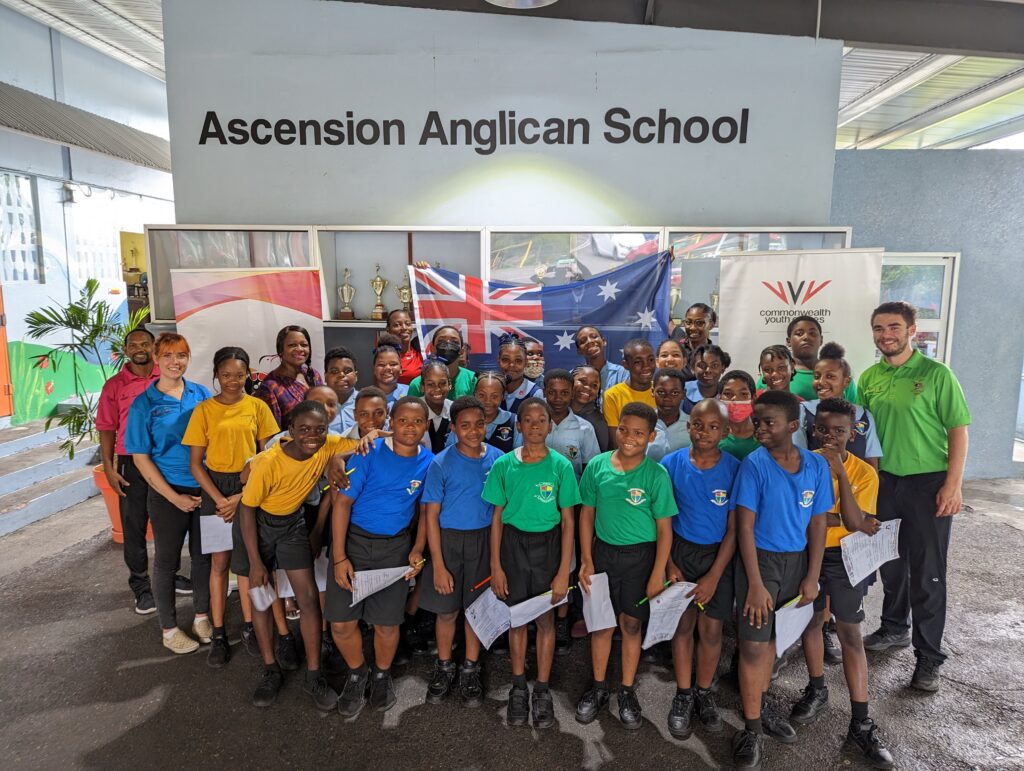 Group shot of a grade class from Ascension Anglican School with Emily and Tyler standing to each side of group.