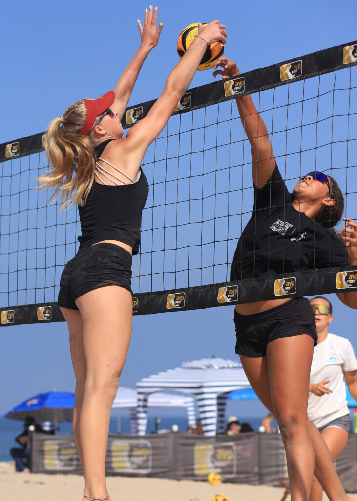 Calinda blocks a spike from the opposing team.